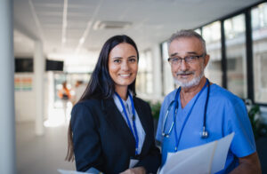 An image of a doctor and a nurse working together to help reduce medical expert witness costs for a law firm