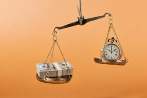 An image of a scale with money on one side and a stop watch other the other, balancing reducing medical expert witness costs by reducing their time by employing legal nurse consultants. 