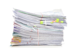This image shows a stack of medical records for review by a Legal Nurse Consultant